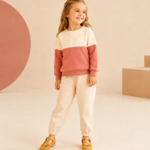Demonstration kidswear sweatshirt in cream and coral.